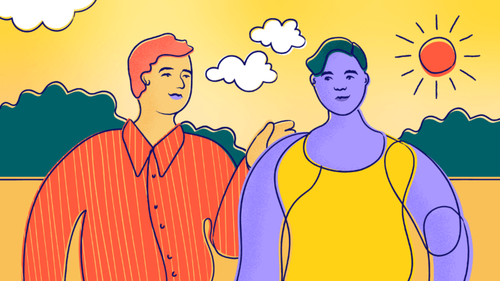 A friend puts an arm on another friend's shoulder outside on a sunny day.