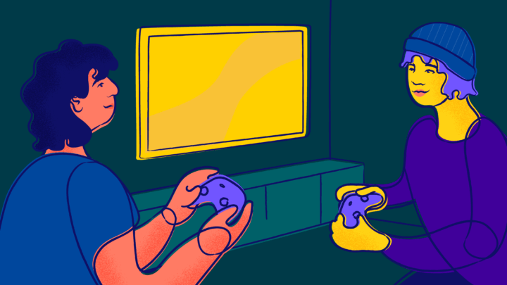 Two friends play video games on a big screen TV.