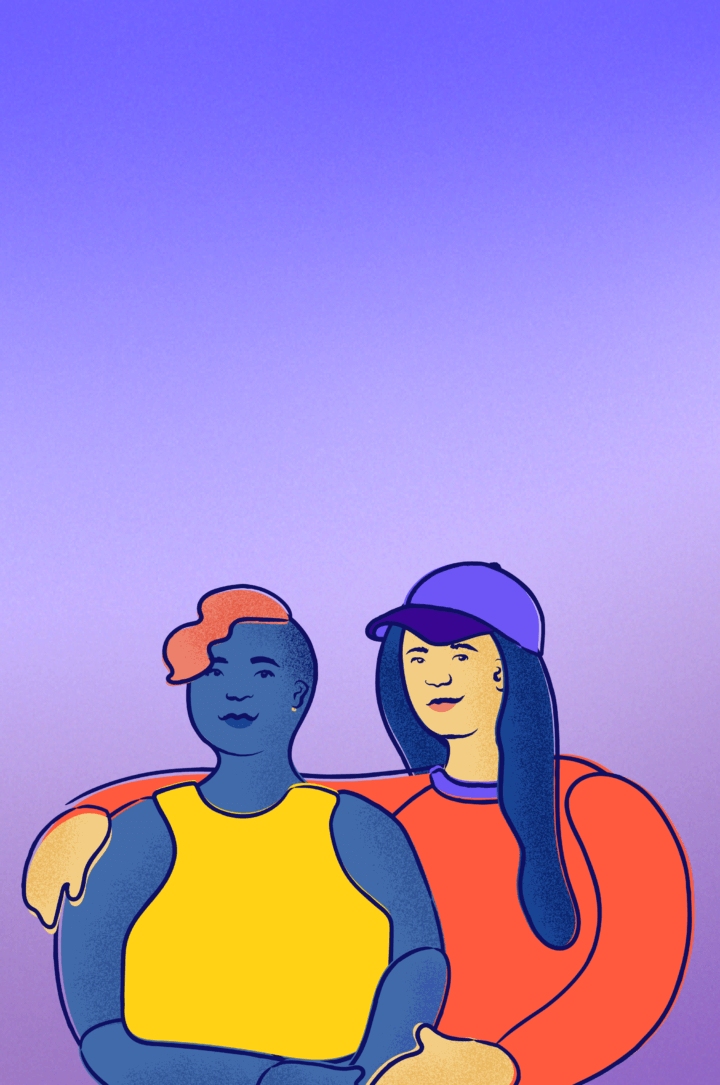 Two friends drape arms over each other's shoulders